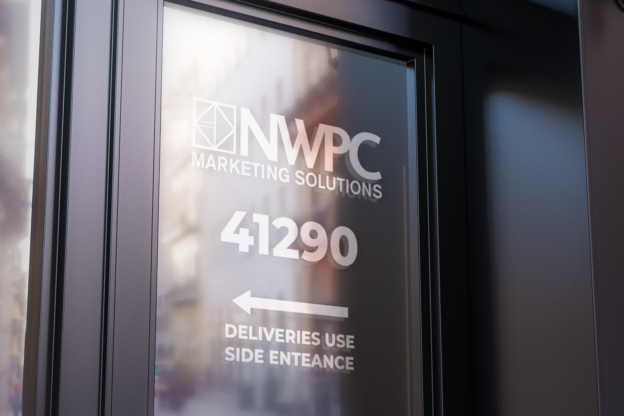 Example of frosted vinyl on office door with NWPC Marketing Solutions logo, address number, and arrow pointing to the deliveries side entrance.